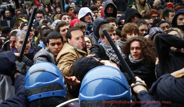 Scontro tra polizia e manifestanti: Berlusconi manganellato
